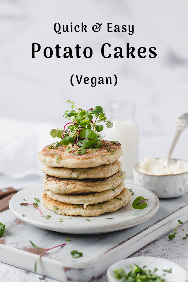 Vegan potato cakes stack garnished with herbs 