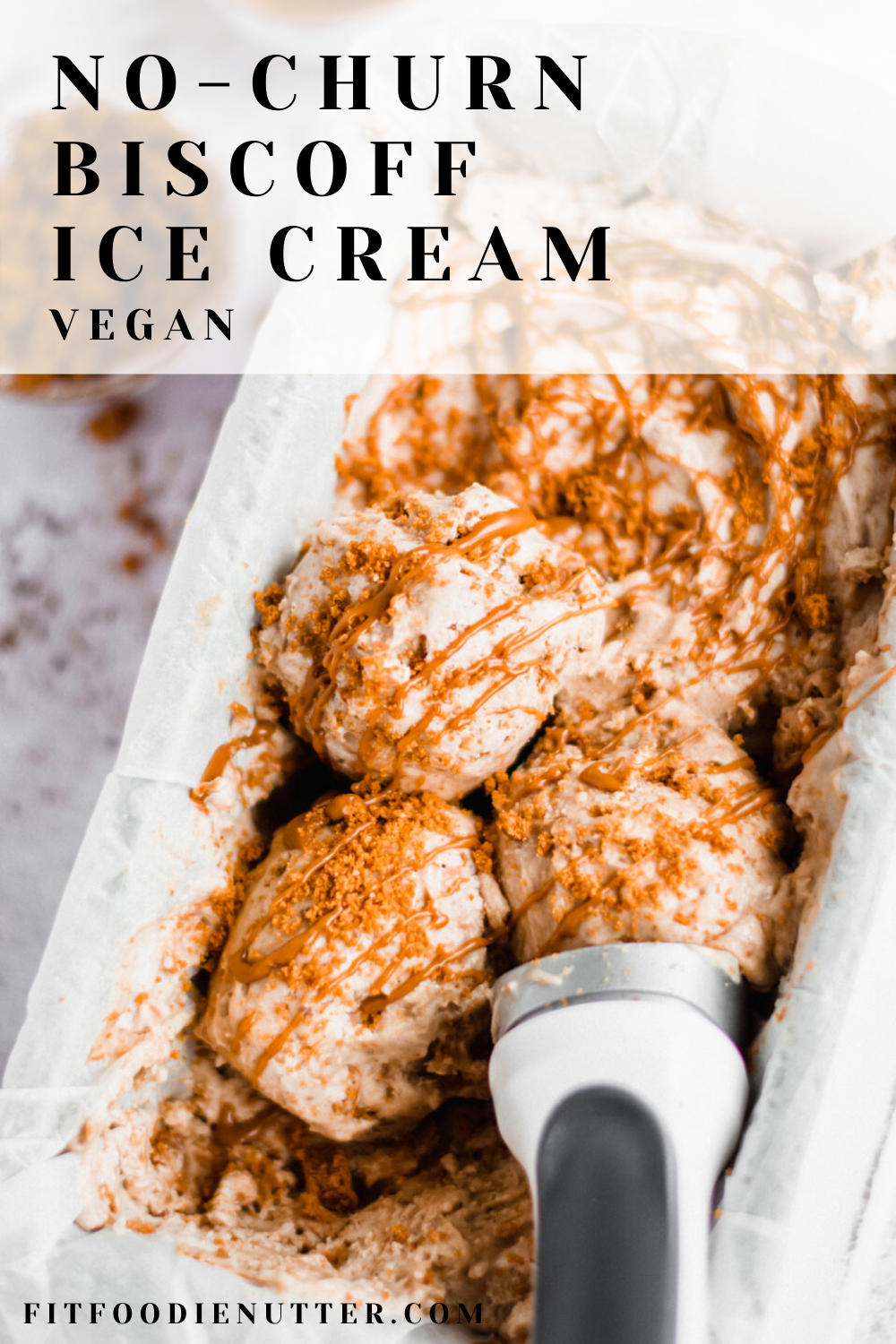 No-churn vegan Biscoff ice cream in container with ice cream scoop