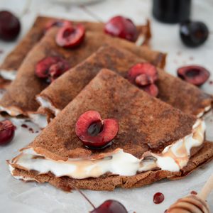 Chocolate protein crepes with yoghurt & fresh cherries