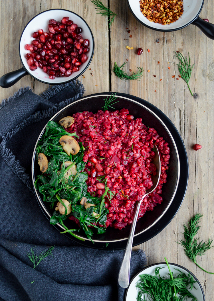 Beetroot & buckwheat risotto on a wooden board