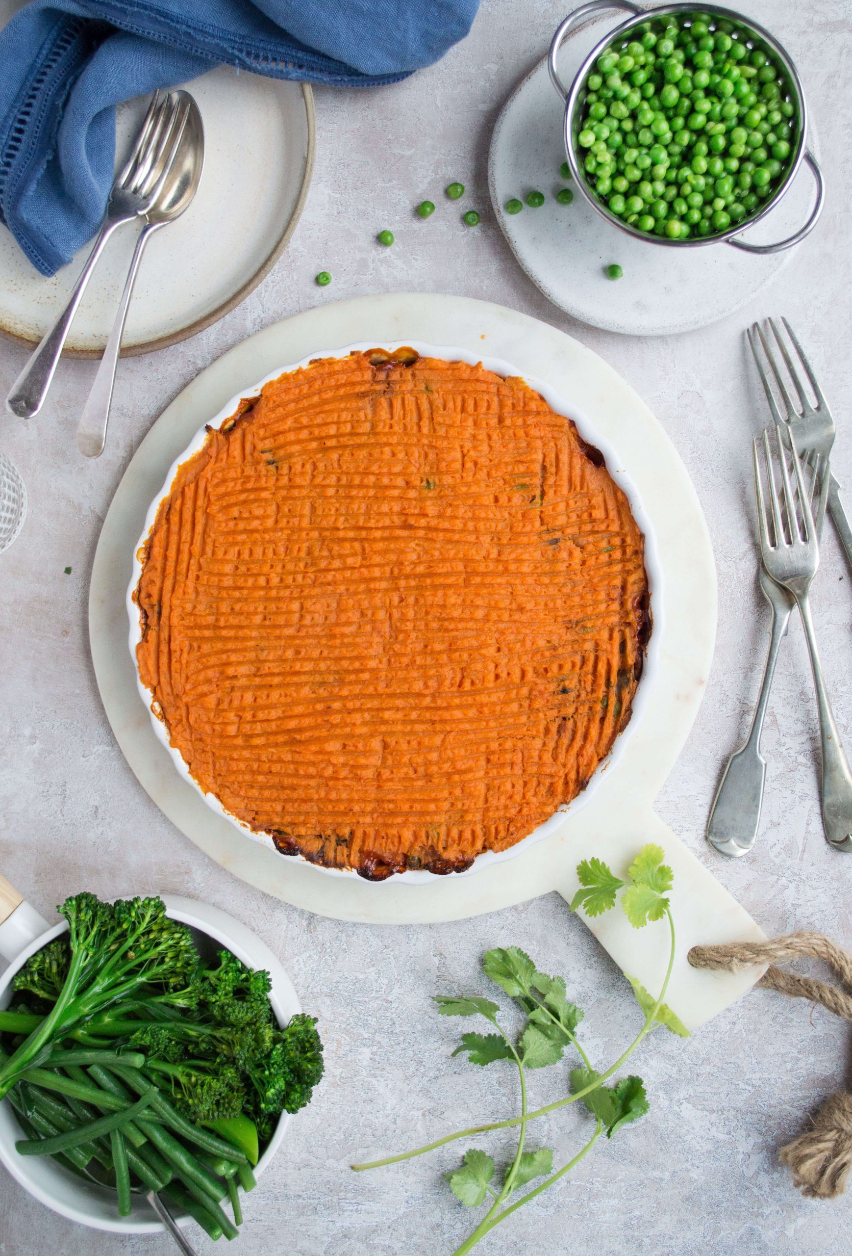 Cottage pie with sweet potato mash in a round white dish