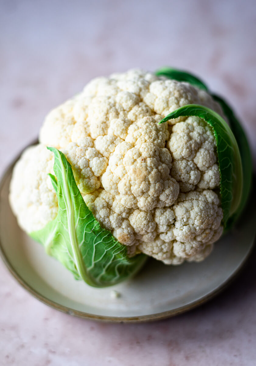 Close up of fresh cauliflower with leaves 