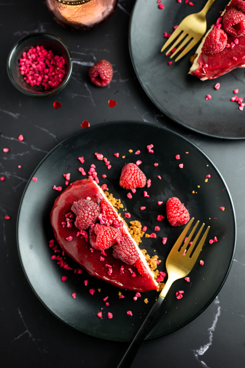 Heart-shaped vegan Valentine’s cheesecake on black plate