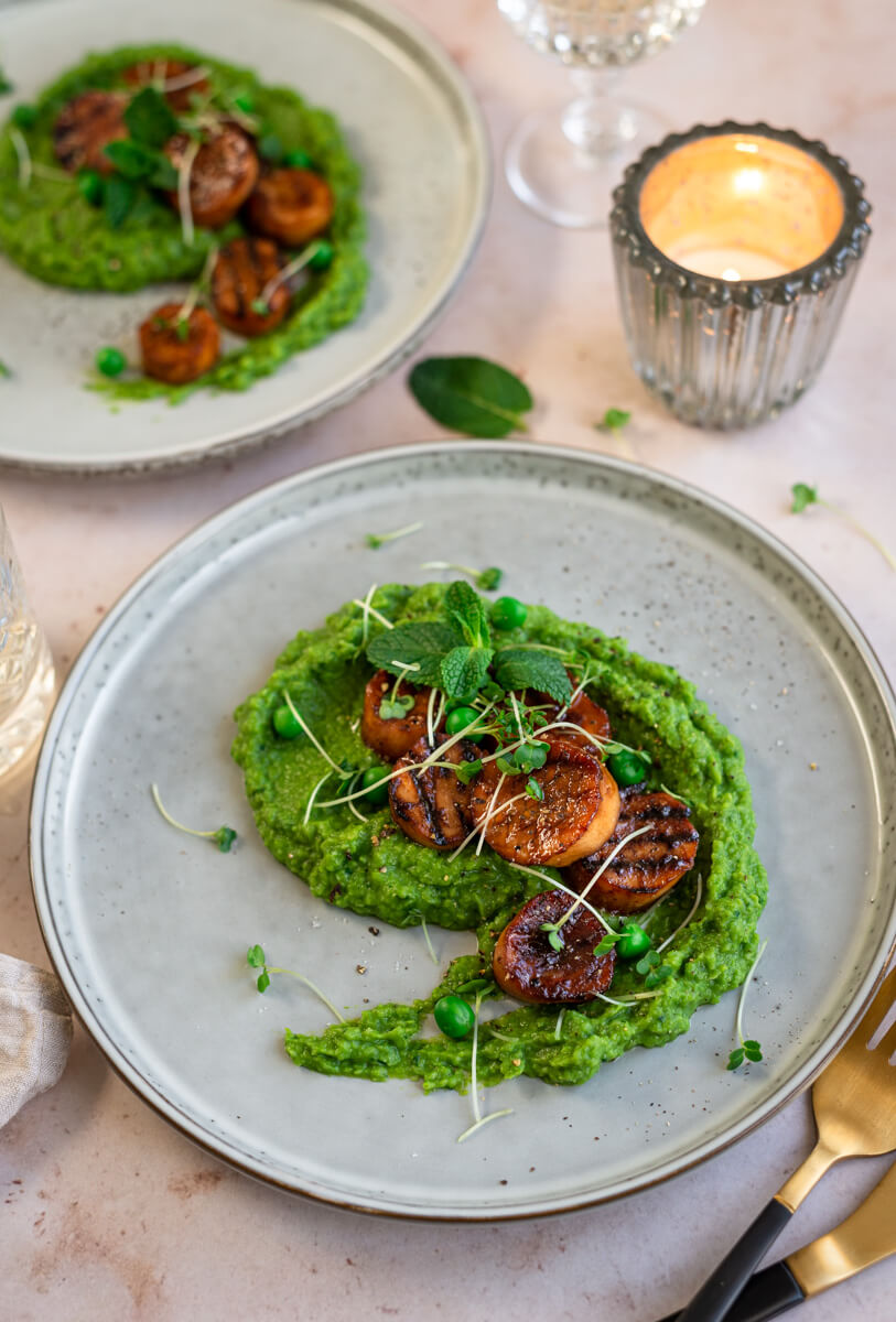 Vegan scallops on a plate with pea puree